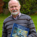 Alan Fearnley with the book of his paintings